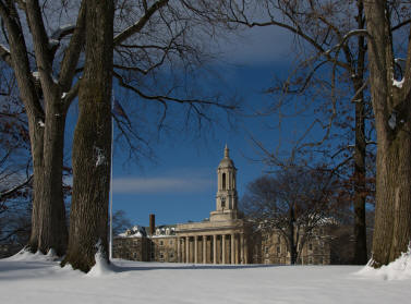 Old Main with Snow and trees